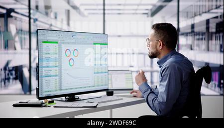 Data Analyst Man Using Spreadsheet On Computer Stock Photo