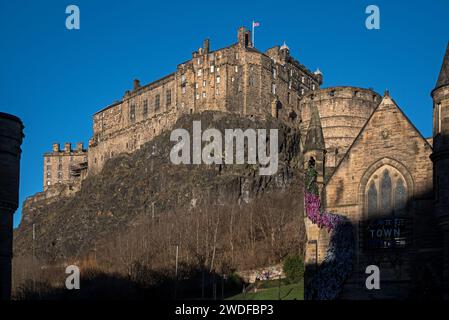 Edinburgh Castle viewed from the Grassmarket in Edinburgh's Old Town on a sunny winter morning. Stock Photo
