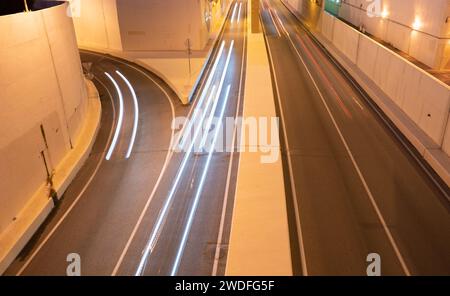 fast-moving freeway traffic long exposure at night. Stock Photo