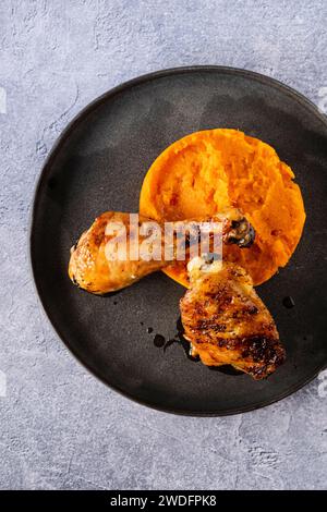 Lemon roasted chicken with sweet potato puree Stock Photo