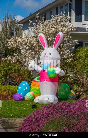 A decorative Easter bunny and eggs on a residential street in Victoria, Vancouver Island, British Columbia, Canada. Stock Photo