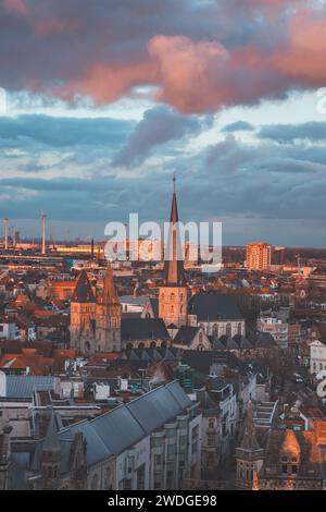 Watching the sunset over Ghent from the historic tower in the city centre. Romantic colours in the sky. Red light illuminating Ghent, Flanders region, Stock Photo