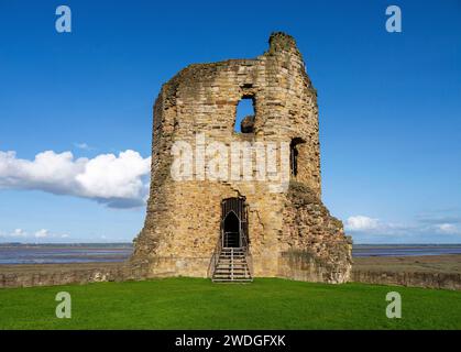 Ruined three-storey eastern corner tower of Flint Castle on a sunny day, with views across the Dee Estuary towards England; Flint, Flintshire, Wales Stock Photo