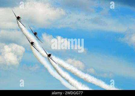 Wantagh, NY, USA May 23, 2008 A team of sky writers turn, with a smoke trail behind them, as they fly through the skies over Wantagh, New York Stock Photo