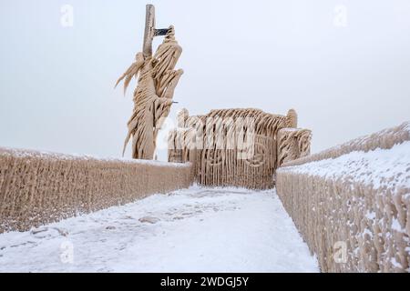 Winter wonderland, gates of Port Stanley pier covered by icicles from Lake Erie frozen waves, extreme winter weather event scene, Ontario, Canada Stock Photo