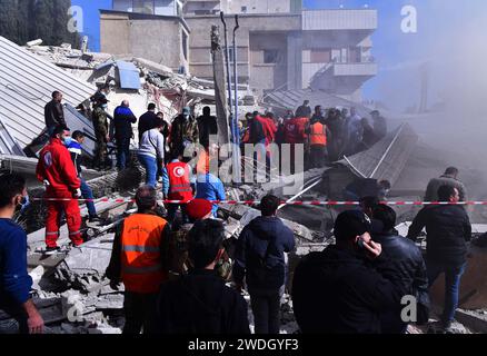 Damascus, Syria. 20th Jan, 2024. Rescuers work at the site of a collapsed building after an Israeli missile attack in the Mazzeh neighborhood of Damascus, Syria, Jan. 20, 2024. Earlier on Saturday, Iran's Islamic Revolutionary Guard Corps (IRGC) said that five of its members serving as military advisers in Syria as well as several Syrian forces and civilians were killed in the Israeli missile attack on the Mazzeh neighborhood of Damascus. Credit: Ammar Safarjalani/Xinhua/Alamy Live News Stock Photo