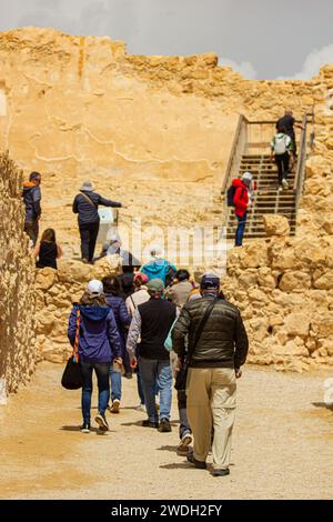 Sunny Stroll: People Walking Among the Ruins of Masada, Israel, on a Bright and Sunny Day Stock Photo