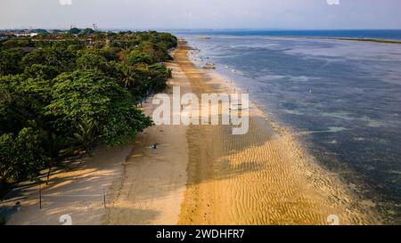 Aerial view of a beautiful tropical beach in the late afternoon sunshine Stock Photo