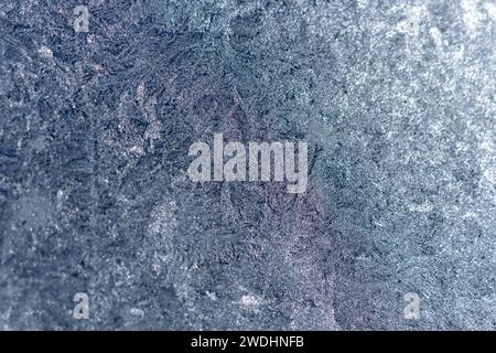 Full frame macro abstract texture background of an ice frosted glass window pane in a color shade of blue, with copy space Stock Photo