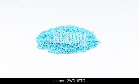 Slug and snail control ferric phosphate blue pellets on white isolated background Stock Photo