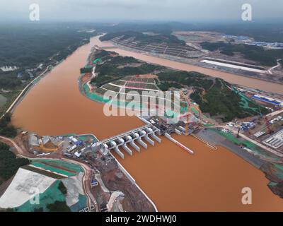 Beijing, China. 20th Jan, 2024. An aerial drone photo taken on Jan. 20, 2024 shows the construction site of a junction of the Pinglu Canal in Qinzhou, south China's Guangxi Zhuang Autonomous Region. The Pinglu Canal is a flagship project on the New International Land-Sea Trade Corridor. It stretches from the Xijin reservoir in the city of Hengzhou to Qinzhou port in the south of Guangxi, where ships can reach the Beibu Gulf via the Qinjiang River, opening a shorter route to the sea for Guangxi and other regions in southwest China. Credit: Zhou Hua/Xinhua/Alamy Live News Stock Photo