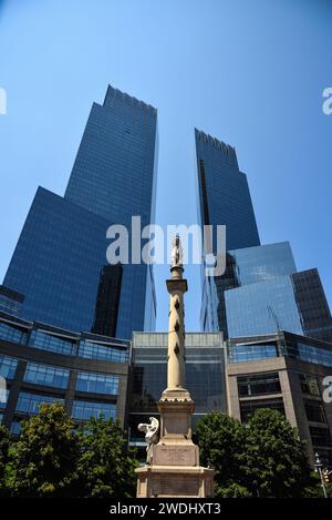 The Columbus Monument on Columbus Circle with the Deutsche Bank Center (former Time Warner Center) in the Background - Manhattan, New York City Stock Photo