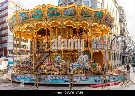 Attraction in the Christmas lights of Vigo, the merry-go-round Stock Photo