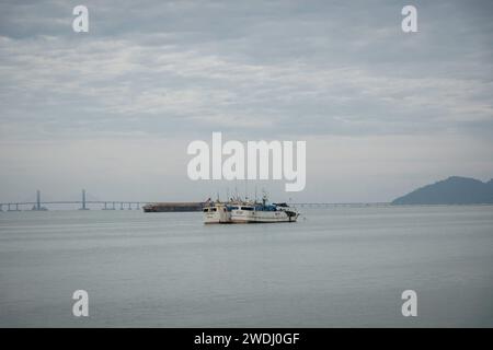 Penang, Malaysia. 17th Jan, 2024. General view of Penang Bridge, at George Town City, Penang Island. George Town is the colorful, multicultural capital of the Malaysian island of Penang. The colonial streets of George Town are a center for culture, street art, and the country's best street food. Credit: SOPA Images Limited/Alamy Live News Stock Photo