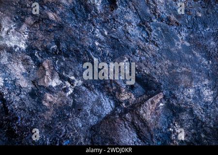 blue covellite (covelline) from kennecott, alaska. macro photography detail texture background. close-up raw rough unpolished semi-precious gemstone Stock Photo