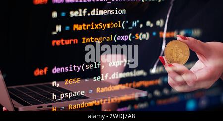 Cryptocurrency concept , Golden bitcoin on winners cup background mainboard , Stock Photo
