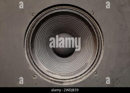 Closeup photo of a speaker. Used studio audio speaker. Music, grunge background. Stock Photo