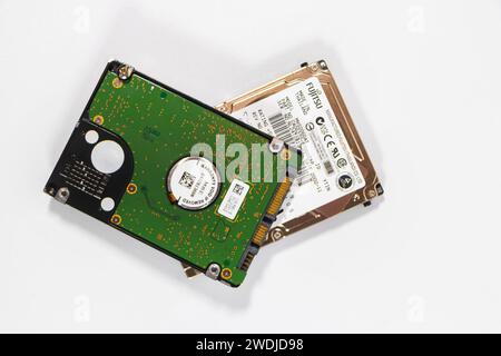 3.5 inch hard drives taken from vintage apple macintosh electronics data storage circuit boards Stock Photo