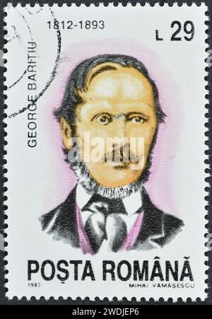Cancelled postage stamp printed by Romania, that shows portrait of George Barițiu, circa 1993. Stock Photo