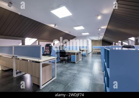 interior in empty work mansard room in modern office or coworking Stock Photo