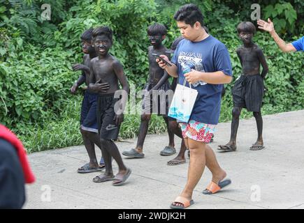 Laguna, Philippines. Jan 21, 2024: Children wearing black makeup (Ati-Atihan) during celebrations of Sto. Niño feast. Festivities include processions, masses, street dancing and Ati-Atihan, which are regularly controversial because compared to Western caricatural blackface. However, this old Filipino tradition has no relation and is not offensive. While similar in gesture, performers of Ati-Atihan Festival wear black soot to pretend to as Atis, honoring dark-skinned indigenous peoples, who historians believed to be the first inhabitants of the Philippines. Credit: Kevin Izorce/Alamy Live News Stock Photo