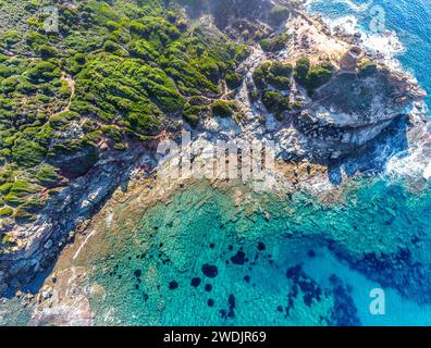 Aerial view of a small cove in Porto Ferro coast on a sunny day. Sardinia, Italy Stock Photo