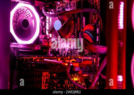 Close up of a desktop computer with pink lights Stock Photo