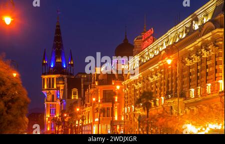 Old National Bank of Georgia and modern Astronomical clock at Memed Abashidze avenue in Batumi. Autonomous Republic of Adjara. Georgia Stock Photo