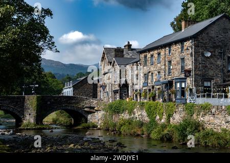 Stone Bridge And River In The City Of Beddgelert In Snowdonia National Park In Gwynedd, Wales, United Kingdom Stock Photo