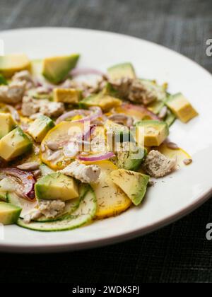 Zucchini salad with home made vegan feta cheese and avocado. Stock Photo