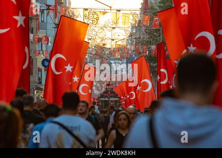 Turkish people and flag of Turkey in Istiklal Avenue. National holidays of Turkiye background photo. Istanbul Turkiye - 10.28.2023 Stock Photo