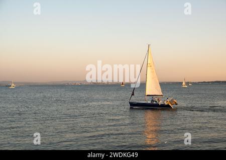Lisbon, Portugal - September 13, 2023. Sailing boat tour on the Tagus River at sunset Stock Photo