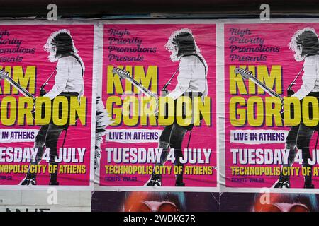 Athens, Greece - May 18, 2023: Kim Gordon live alternative rock music concert posters on city wall. Stock Photo