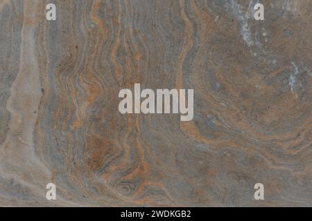 Metamorphic rock abstract background textured foliation stone surface. Stock Photo