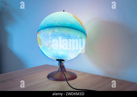 An illuminated globe showing the Pacific Ocean. Used in geography class to show that most of the earth is covered by water. Stock Photo