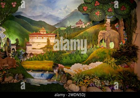 Paintings of rural scenes and the iconic Paro Dzong (fort) as a Welcome to the Kingdom of Bhutan display in the arrivals hall at Paro Airport, Bhutan Stock Photo