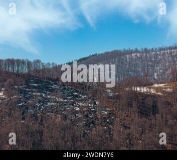 Early spring Carpathian mountains plateau landscape with snow on slope, Ukraine. Stock Photo