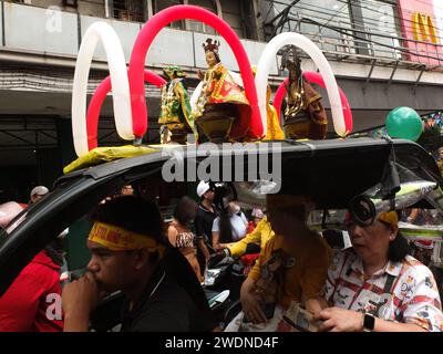 Malabon, Philippines. 21st Jan, 2024. Sto. Niño replicas adorned with balloons on top of a tricycle during the parade. The Feast Sto. Niño or the holy child Jesus is celebrated every third Sunday of January, The replicas are paraded all over the country. They symbolize the birth of Catholicism in the Philippines more than 500 years ago. Credit: SOPA Images Limited/Alamy Live News Stock Photo