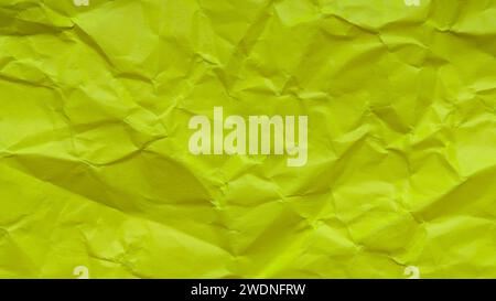 Background from Crumpled Yellow Green Paper, Textured Color Paper with Folds Stock Photo