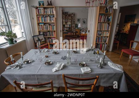 The party is over. Dinner table after party. Empty plate after dinner. Dinner set for home event. Dirty table after banquet. Celebration at home. Stock Photo