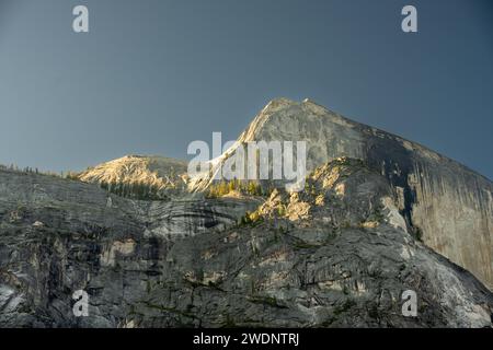 Clouds Rest Over Layers of Granite Cliffs in Yosemite National Park Stock Photo