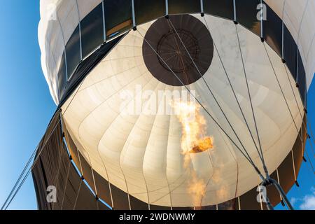 A view from below to the inside of the white, hot air balloon dome. Horizontal photo. Stock Photo