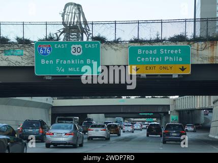 Philadelphia, Pennsylvania, U.S.A - January 14, 2024 - The view of traffic near Interstate 676 East into the exit for Ben Franklin Bridge, 30 East and Stock Photo