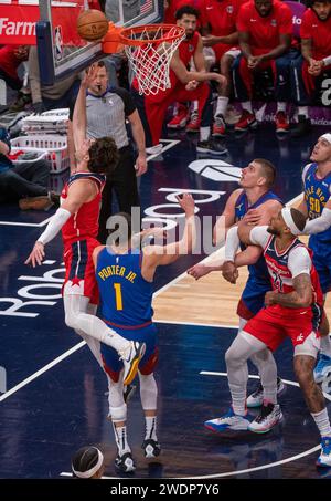 Washington, USA. 21st Jan, 2024. WASHINGTON, DC - JANUARY 21: Washington Wizards forward Deni Avdija (8) goes for a shot over Denver Nuggets forward Michael Porter Jr. (1) during a NBA game between the Washington Wizards and the Denver Nuggets, on January 21, 2024, at Capital One Arena, in Washington, DC. (Photo by Tony Quinn/SipaUSA) Credit: Sipa USA/Alamy Live News Stock Photo