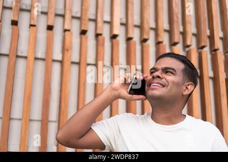 Latin Man Talking on the Phone with Braces Stock Photo