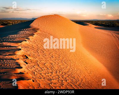 The sun sets on sand dunes in the desert near Horizon City, east of El Paso, Texas. Stock Photo