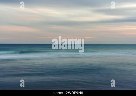 Ocean and cloudy sky, abstract background, motion blur. Stock Photo