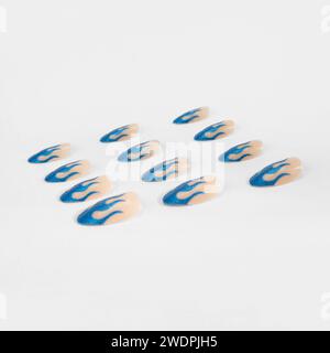 realistic set of colored false nails adhesive isolated on white background. top view. false nails acrylic nails for women. Stock Photo