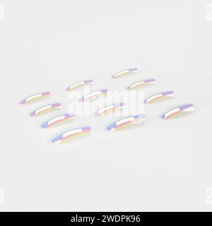 realistic set of colored false nails adhesive isolated on white background. top view. false nails acrylic nails for women. Stock Photo