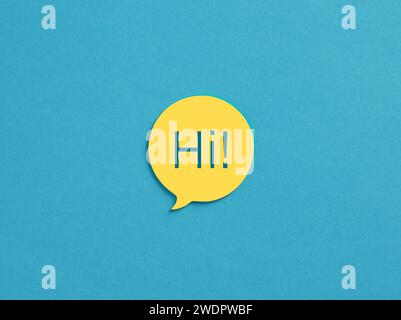The word Hi on yellow speech bubble over blue background. Stock Photo